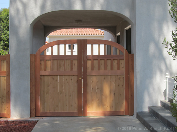 Photo of a Curved / Arched Spanish Style Driveway Gate Made to Match Arch - Lafayette Park / Los Angeles, CA